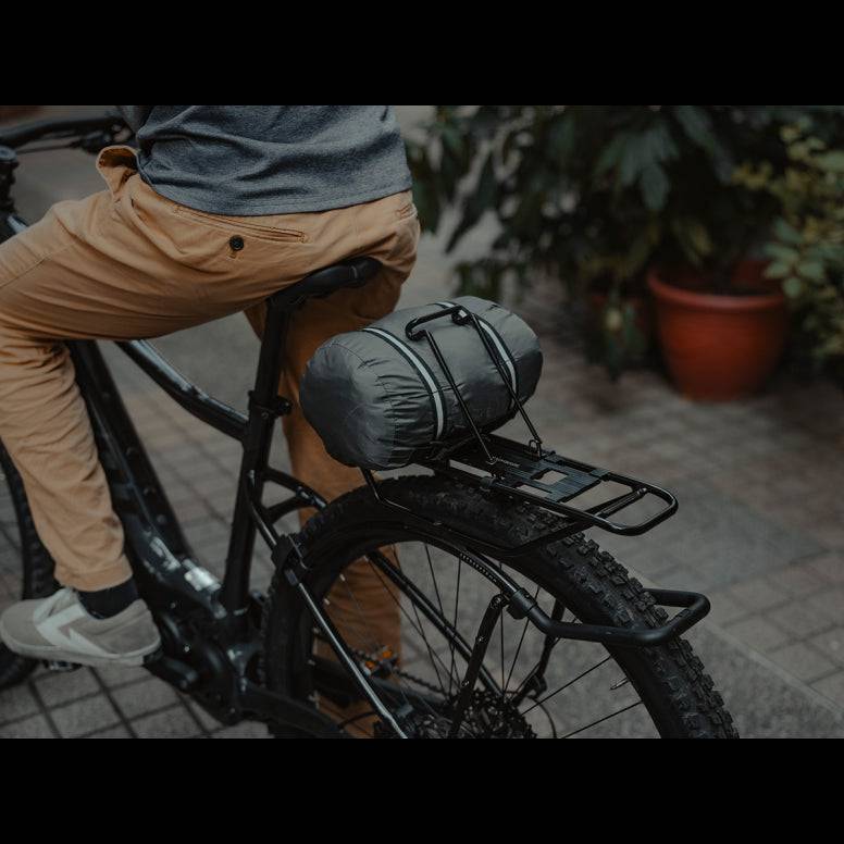 Black Topeak Spring Clip accessory for Tetrarack M2, M2L, and M2 HD bike racks, shown attached to the rack in the image.