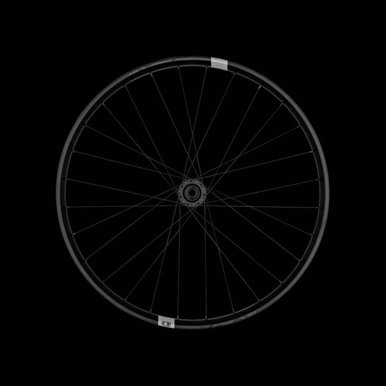 Crank Brothers Synthesis Carbon E-Bike mountain bike wheels with sleek black rims and spokes for trail riding, showcasing lightweight carbon design.