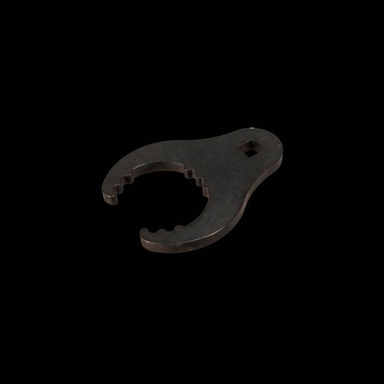 Cane Creek DB Inline glandnut wrench for precise rear shock maintenance, shown with the wrench tool on shock components.