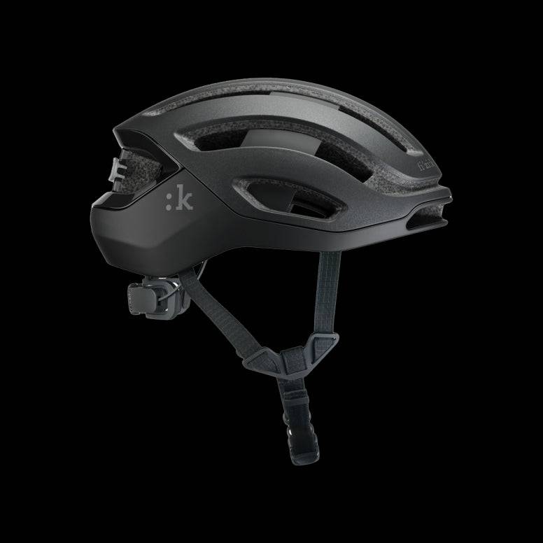 Fizik Kudo cycling helmet with MIPS, ventilation, rear light, lightweight design, and aerodynamic features for safety and comfort.