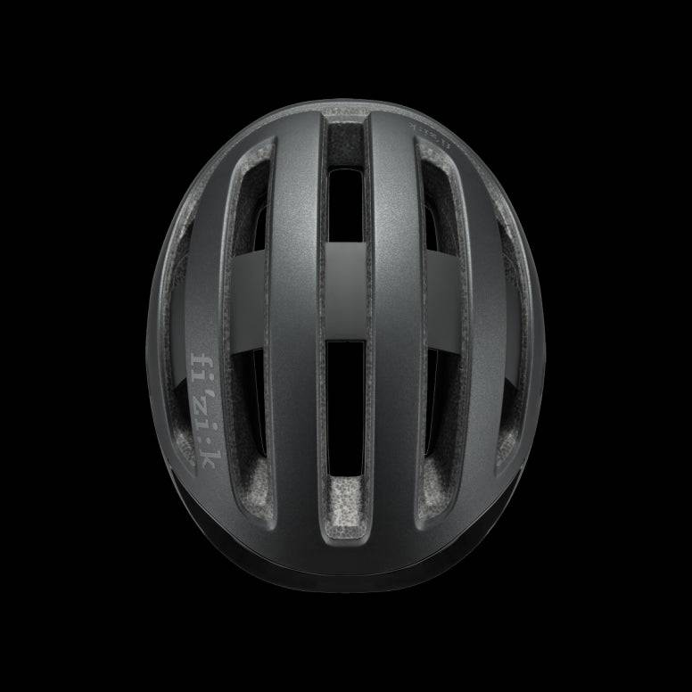 Fizik Kudo cycling helmet with MIPS, ventilation, and rear light, designed for safety and comfort during bike rides.