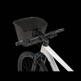 Topeak Urban Basket Front in black with QuickClick system mounted on a bike handlebar for convenient storage.