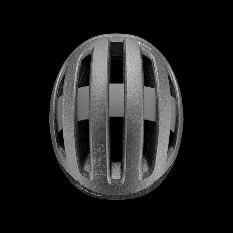 Fizik Kudo cycling helmet with MIPS, ventilation, and rear light, designed for safety and airflow during bike rides.