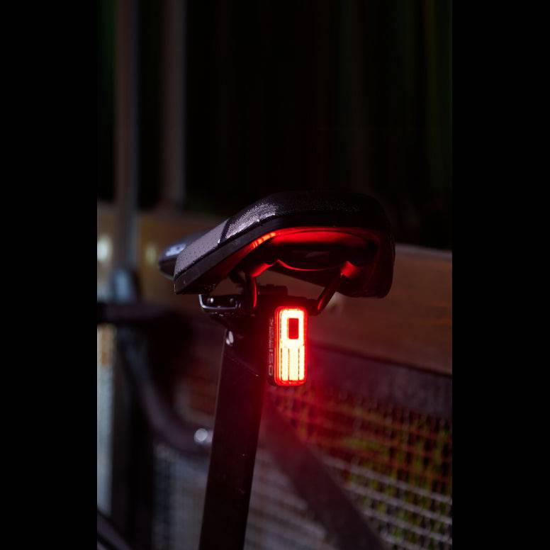 Moon Sport Helix Sense rear bike light with auto brightness and braking alert, featuring 150 lumens for safety visibility.