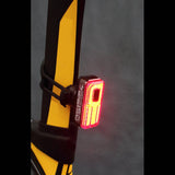 Moon Sport Helix Sense 150lm rear bike light with auto brightness and braking features mounted on a bicycle for safety.