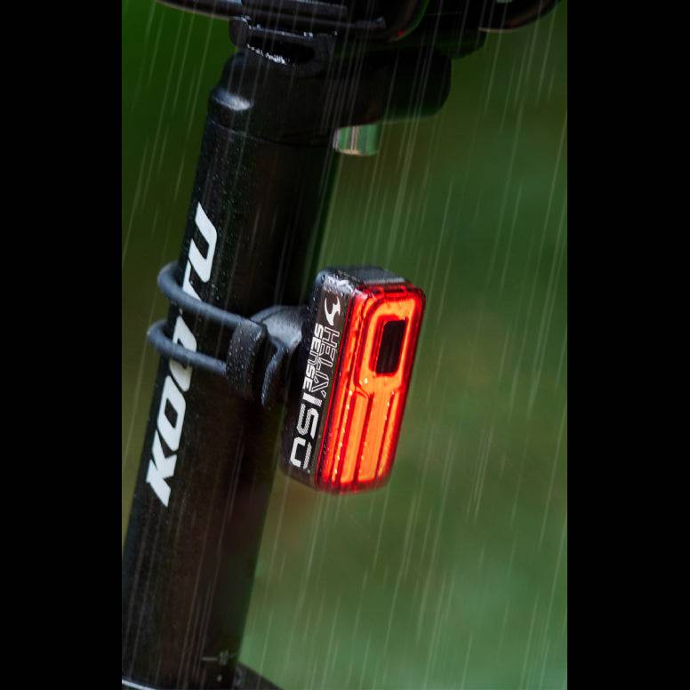 Moon Sport Helix Sense 150lm rear bike light with braking and auto brightness features, mounted on a bicycle for safety.