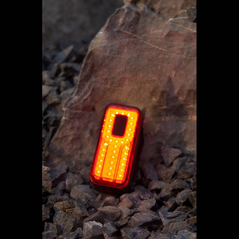 Moon Sport Helix Sense 150lm rear bike light showing auto brightness, braking feature, and compact design for safety and visibility.