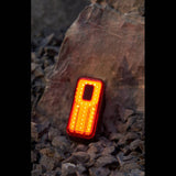 Moon Sport Helix Sense 150lm rear bike light showing auto brightness, braking feature, and compact design for safety and visibility.