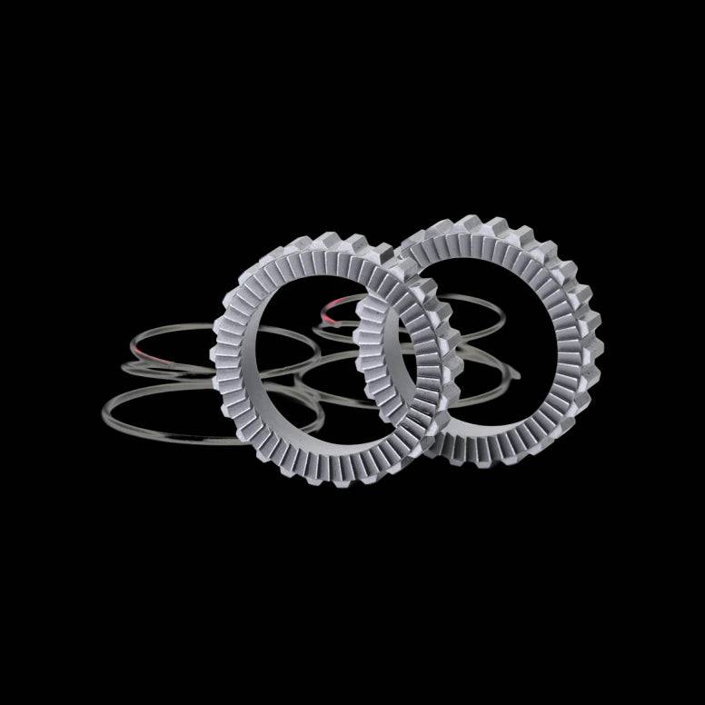 Crankbrothers Synthesis 54T Ratchet Upgrade Kit in silver for faster hub engagement on bicycle components.