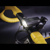 Moon Sport VELA 200lm front and ORION 50lm rear bike light set in black, showing the compact, durable design for cycling safety.
