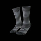 Fizik Fade cycling socks in black and white with breathable, moisture-wicking fabric and durable construction for performance riding.