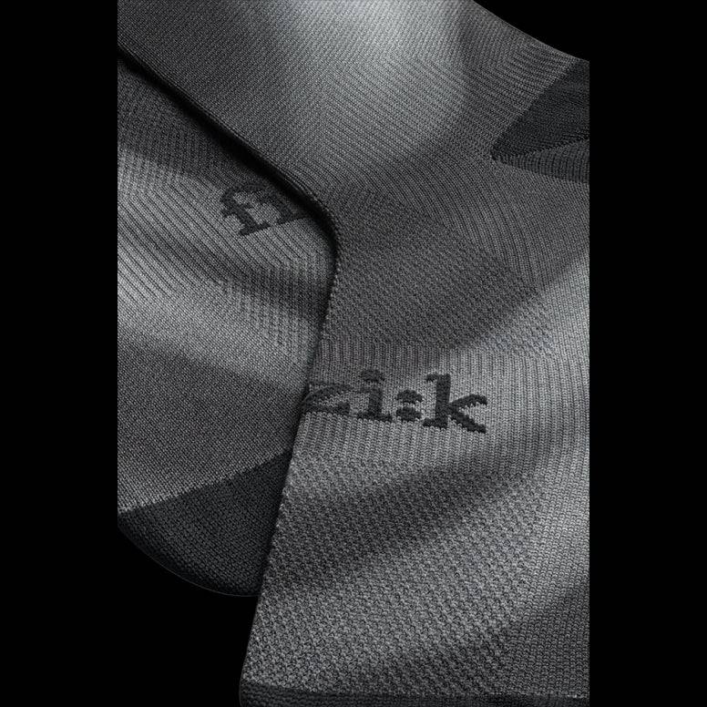Fizik Fade cycling socks, breathable and moisture-wicking performance clothing with durable fabric, designed for cycling comfort.