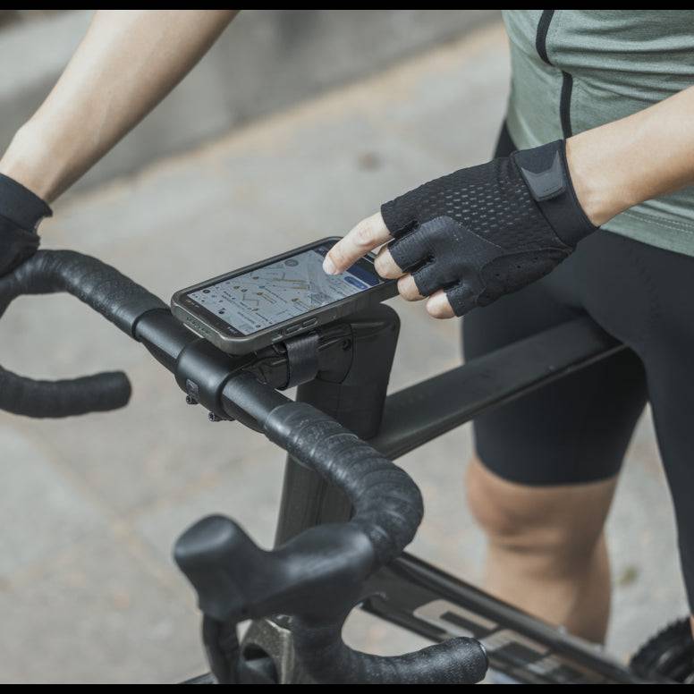 Black Topeak Ridecase multi-mount bike phone holder attached to a 35-48mm stem, designed for secure smartphone mounting during rides.