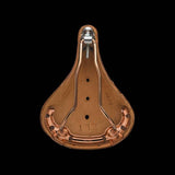 Brooks B17 Special short road bike saddle with copper steel rails and rivets, close-up view of saddle's leather surface and construction.