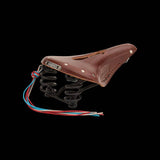 Brooks Flyer Carved Touring Saddle with pressure relief cut-out and steel rails, designed for comfortable bike riding.