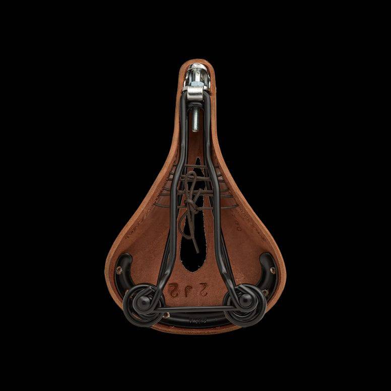 Brooks Flyer carved touring saddle with pressure relief cut-out and steel rails, designed for comfortable cycling.