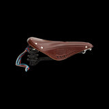 Brooks Flyer Carved Touring Saddle with pressure relief cut-out and steel rails, designed for comfortable bike touring.