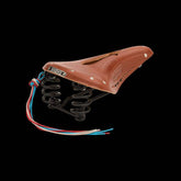 Brooks Flyer Carved Touring Saddle with pressure relief cut-out and steel rails, designed for comfortable cycling components.
