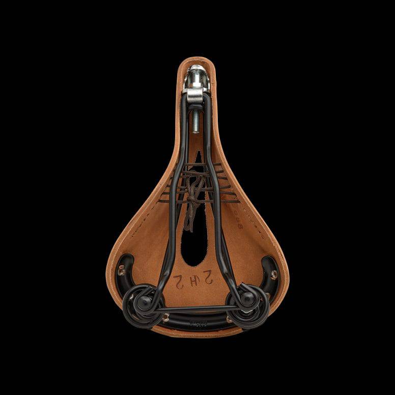 Brooks Flyer Carved Touring Saddle with pressure relief cut-out and steel rails, designed for comfortable bike riding.