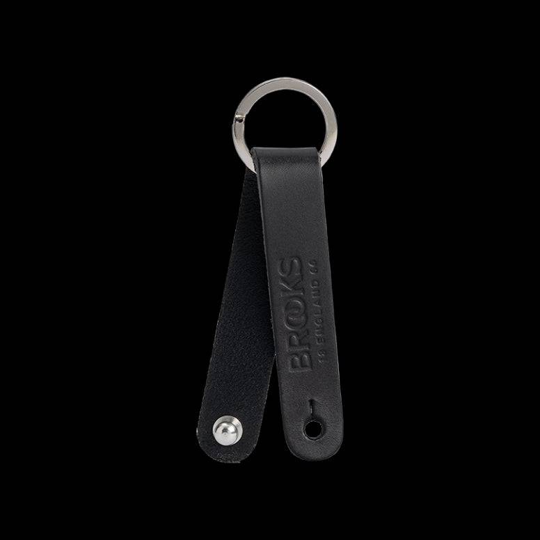 Brooks Hub Shiner leather bike hub cleaner and keychain accessory, compact component with leather and metal details.