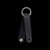 Brooks Hub Shiner leather bike hub cleaner and keychain accessory, compact component with leather and metal details.