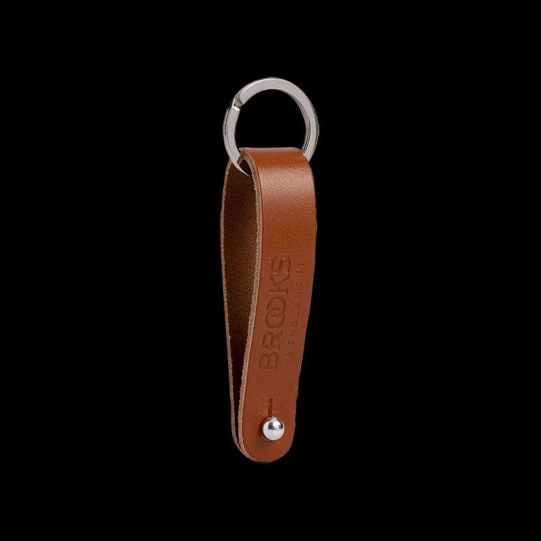 Brooks Hub Shiner leather bike hub cleaner and keychain accessory, featuring a compact design with leather accents and keyring attachment.