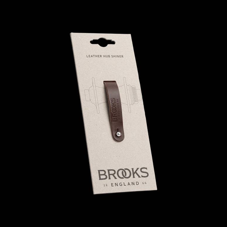 Brooks Hub Shiner leather bike hub cleaner and keychain accessory, featuring a compact design with leather finish and metal keyring.