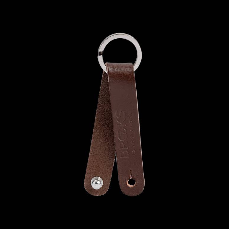 Brooks Hub Shiner leather bike hub cleaner and keychain accessory with Brooks logo, designed for bike maintenance and style.