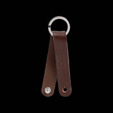 Brooks Hub Shiner leather bike hub cleaner and keychain accessory with Brooks logo, designed for bike maintenance and style.