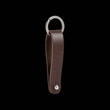 Brooks Hub Shiner leather bike hub cleaner and keychain accessory, featuring polished leather and metal components.