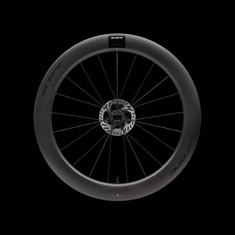 Scope Cycling R6.A V2 65mm allroad tubeless-ready wheelset with aerodynamic design, shown with close-up of black alloy wheels.