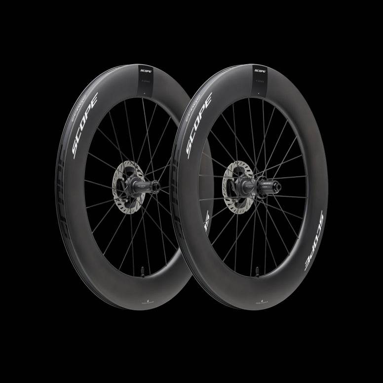Scope Cycling R8.T V2 85mm triathlon and time trial wheelset with aerodynamic design, black carbon fiber wheels, and sleek spokes.