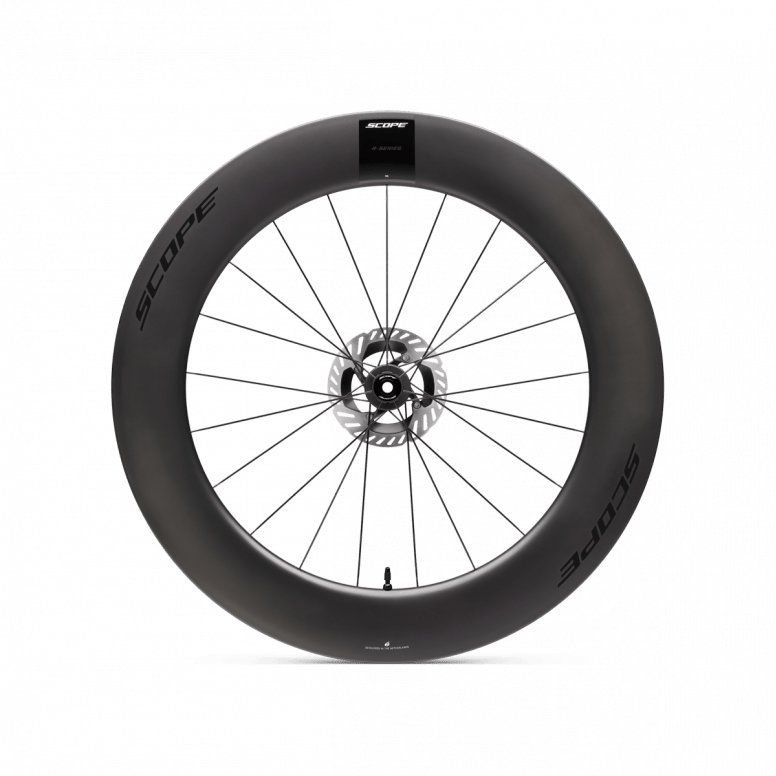 Scope Cycling R8.T V2 85mm TT front wheel showing aerodynamic carbon rim and sleek spokes for time trial cycling.