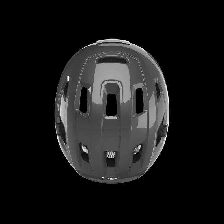 MET E-Mob Mips helmet for urban e-bike riders, featuring integrated USB LED rear light and adjustable straps.