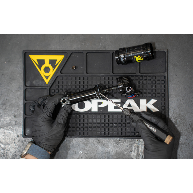 Topeak Utility Workshop Tool with interchangeable picks and quick release mechanism for versatile bike maintenance.