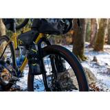 Cane Creek Invert Cargo Mount for bikepacking forks with 3-bolt interface, shown attached to bike fork with mounting hardware