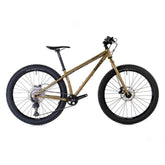 Surly Karate Monkey 27.5+ mountain bike frame with Deore drivetrain, featuring rugged tires and durable construction for off-road riding.