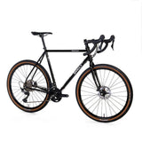 Surly Midnight Special GRX gravel bike with 700c wheels, disc brakes, and a versatile frame suitable for mixed terrain.