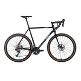 Surly Midnight Special GRX gravel bike with 700c wheels and disc brakes, versatile frame for mixed terrain riding.