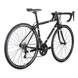 Light Blue Sport Wolfson Sora R3000 18-speed road bike with Shimano gears and Reynolds 853 steel frame, shown with rider in action