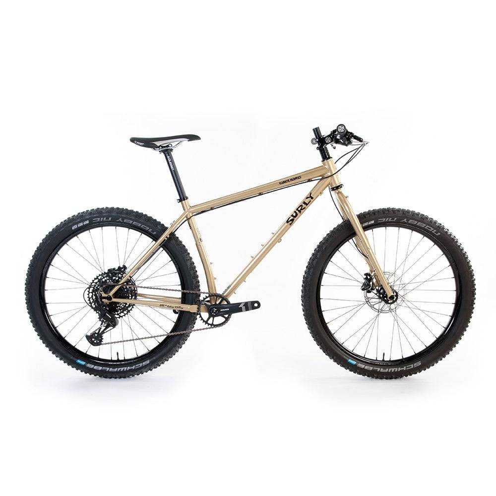 Surly Karate Monkey 27.5+ trail hardtail mountain bike frame in gold, designed for versatile mountain biking performance.