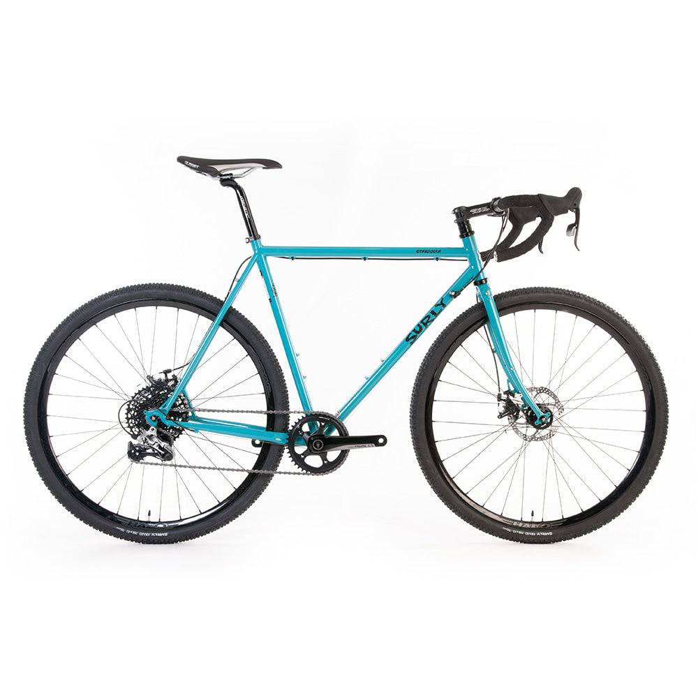 Surly Straggler 1x gravel bike with steel frame, drop handlebars, and knobby tires for commuting, touring, and gravel riding.