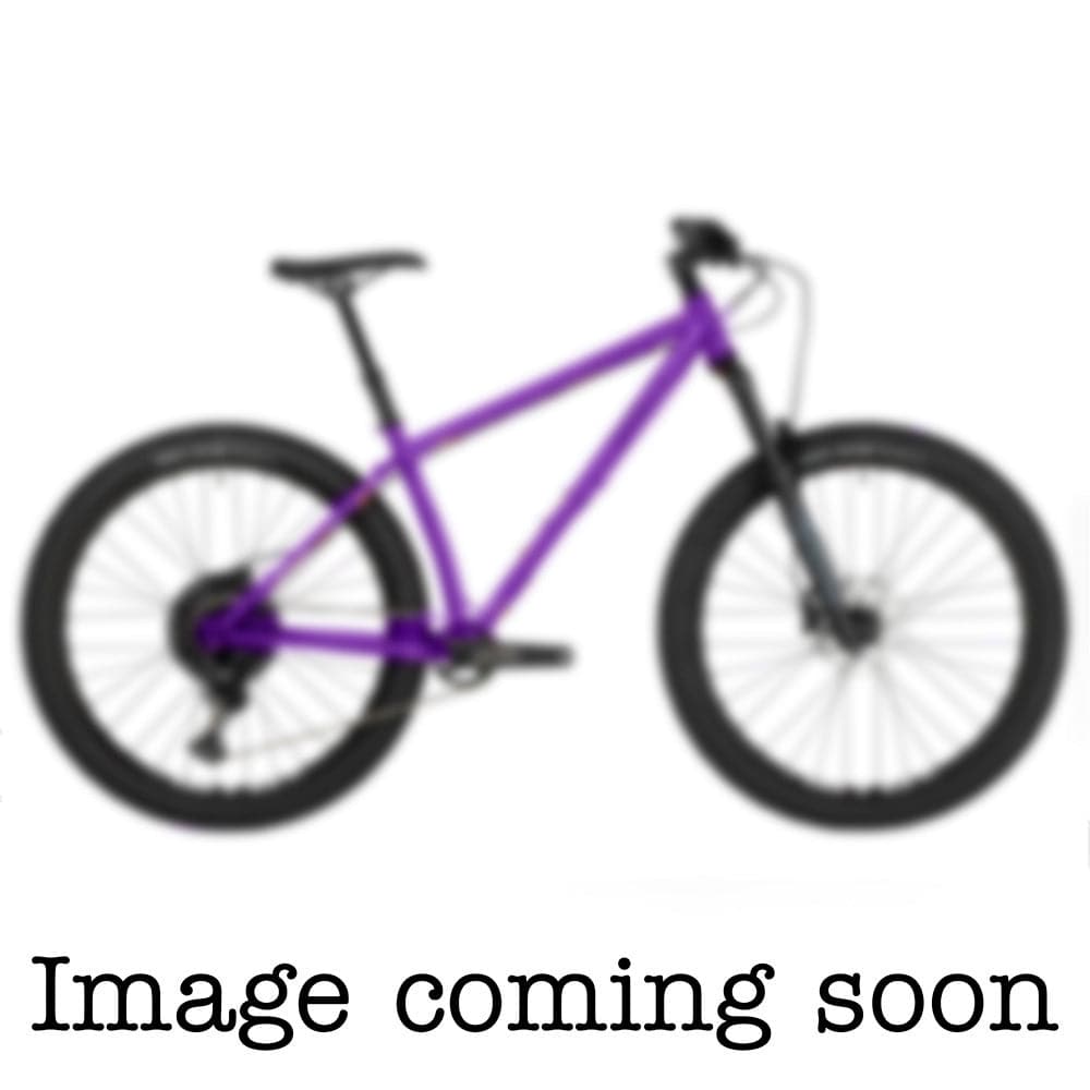 Surly Karate Monkey 27.5+ suspension mountain bike frame with boost hub compatibility, shown in a natural outdoor setting.