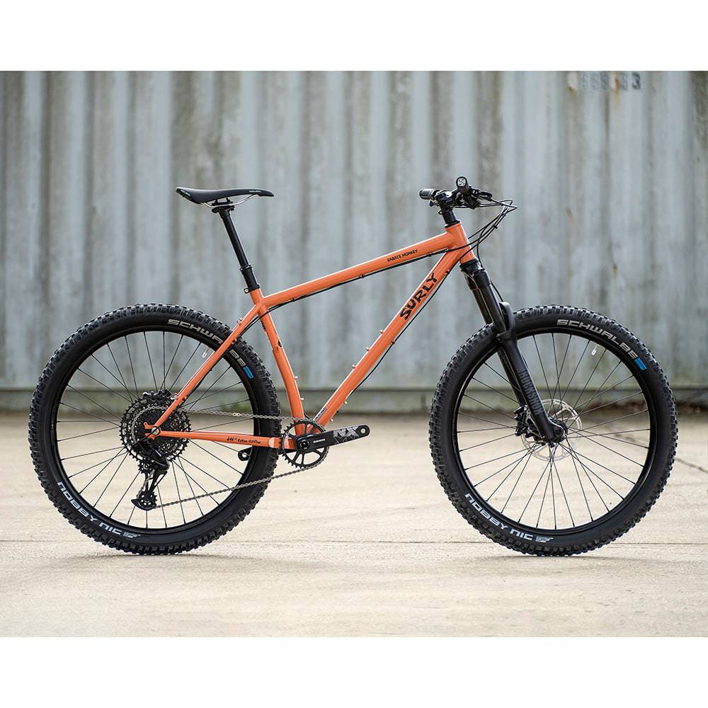 Surly Karate Monkey 27.5+ suspension mountain bike frame with boost hub compatibility, black frame with rear suspension and mountain bike design.