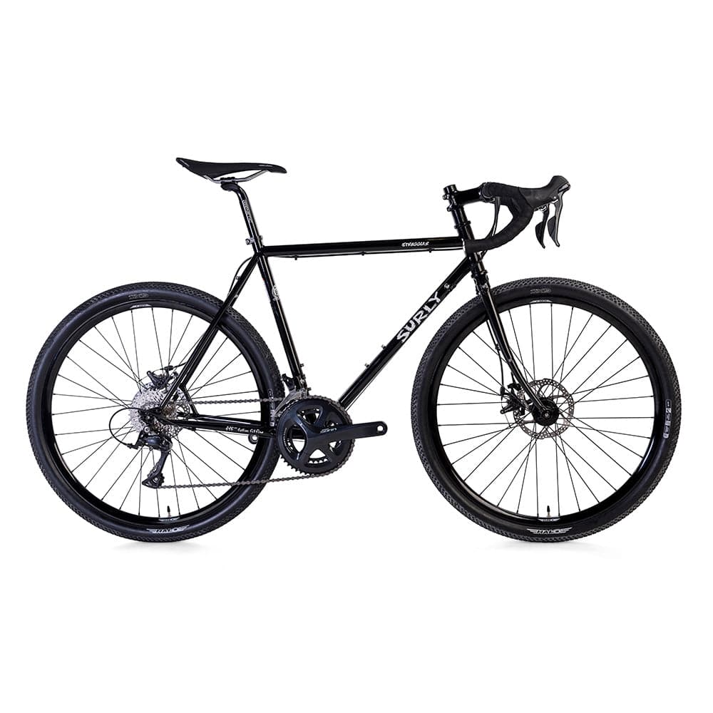 Black Surly Straggler 650b Sora gravel bike with steel frame, suitable for commuting and touring, shown from side view.