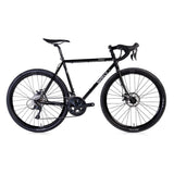 Black Surly Straggler 650b Sora gravel bike with steel frame, suitable for commuting and touring, shown from side view.
