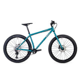 Surly Karate Monkey 27.5+ mountain bike frame with Deore drivetrain, blue frame, and suspension-ready design.
