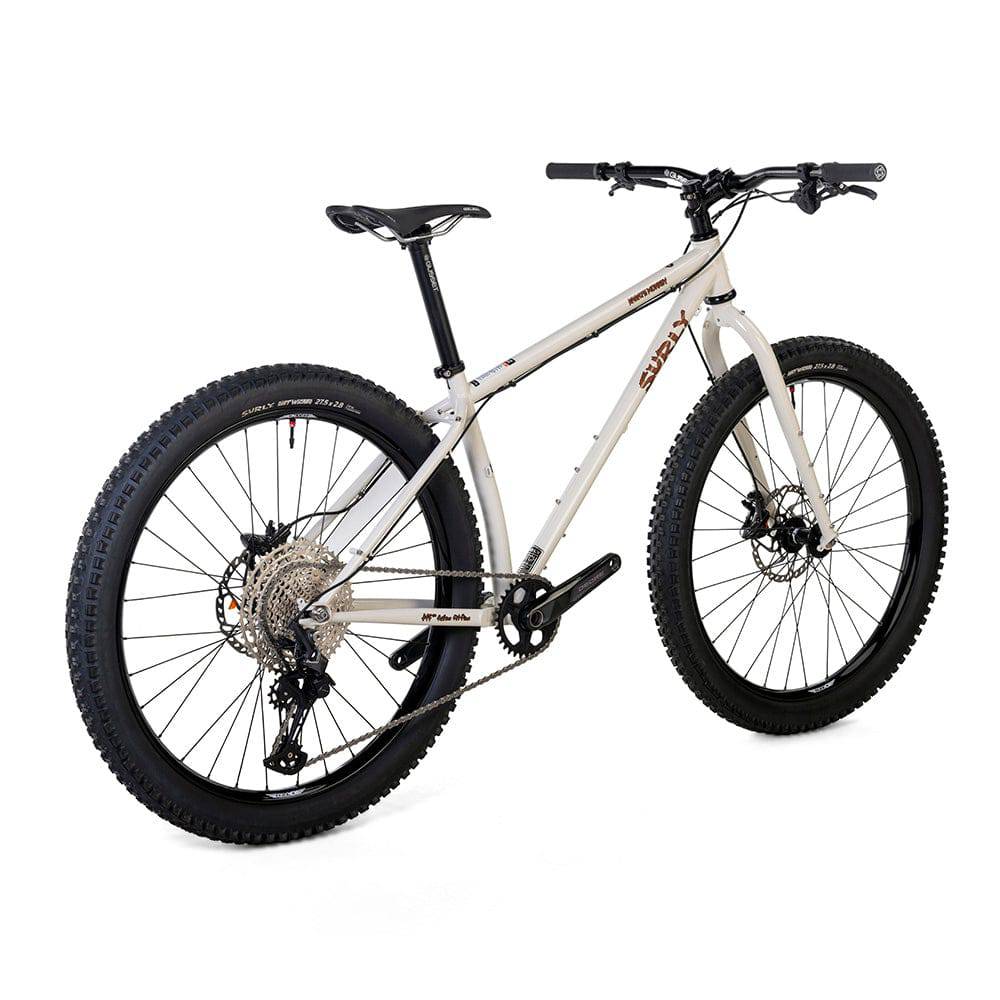 Surly Karate Monkey 27.5+ mountain bike frame with Deore drivetrain, black and white color, showing the sturdy bike frame and components