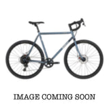 Surly Straggler 650b Sora gravel bike with steel frame, drop handlebars, and knobby tires for commuting and touring.