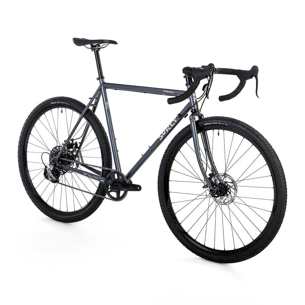 Surly Straggler 1x gravel bike with steel frame in dark blue, designed for commuting, touring, and gravel riding.